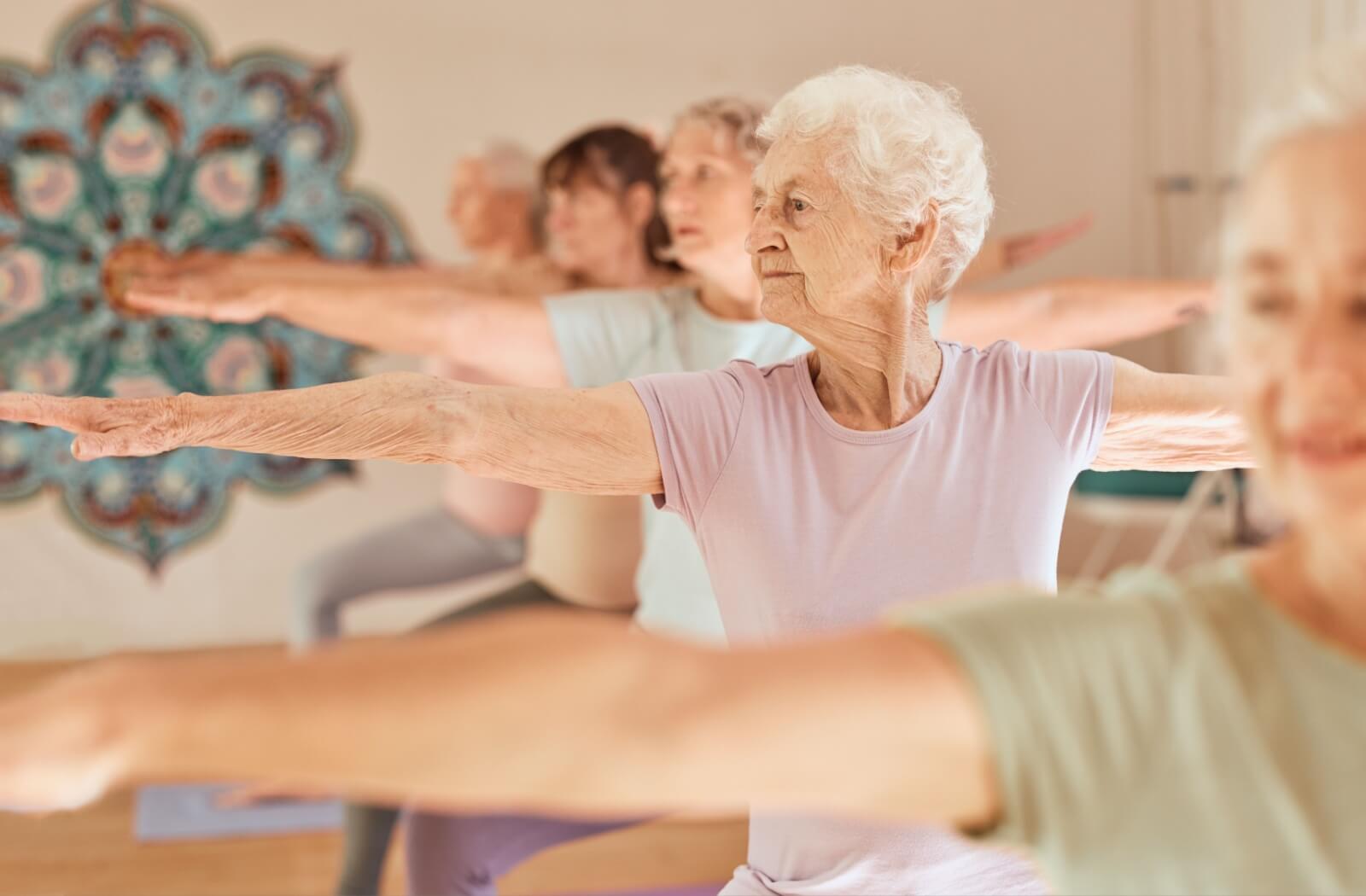 A group of older adults doing a fitness class